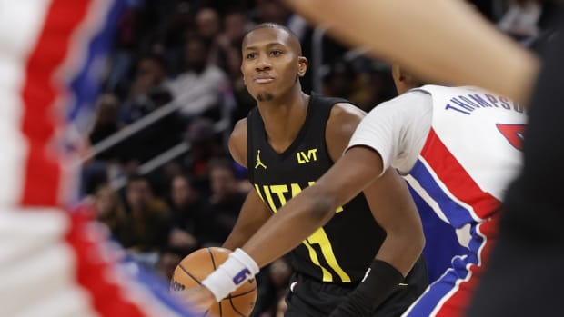 Utah Jazz guard Kris Dunn (11) dribbles in the second half against the Detroit Pistons at Little Caesars Arena.